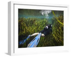 A Scuba Diver Swims Through an Underwater Field of Tape Grass-null-Framed Art Print