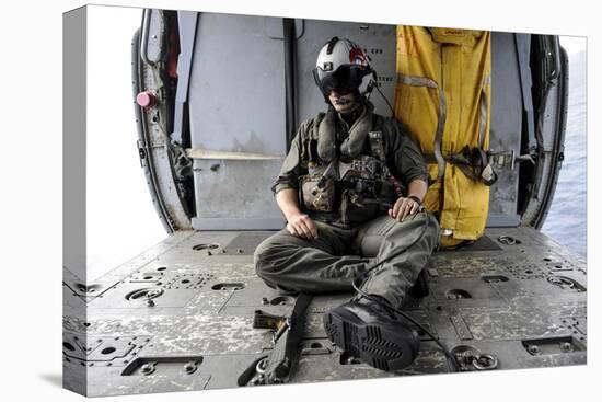 A Search and Rescue Swimmer Sits in the Back of an Mh-60S Sea Hawk-null-Stretched Canvas
