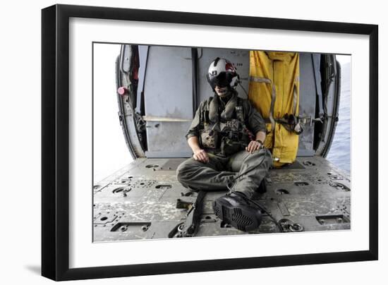 A Search and Rescue Swimmer Sits in the Back of an Mh-60S Sea Hawk-null-Framed Photographic Print