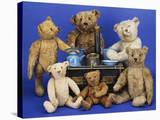 A Selection of Teddy Bears around a Black Painted Tinplate Toy Stove-null-Stretched Canvas