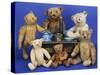 A Selection of Teddy Bears around a Black Painted Tinplate Toy Stove-null-Stretched Canvas