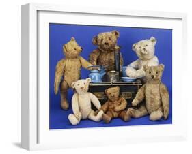 A Selection of Teddy Bears around a Black Painted Tinplate Toy Stove-null-Framed Giclee Print