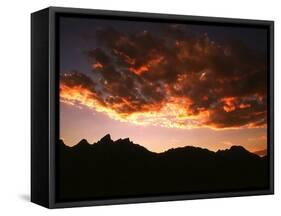 A Setting Sun Casts a Colorful Light on the Teton Mountains Near Jackson Hole-null-Framed Stretched Canvas