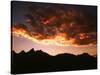A Setting Sun Casts a Colorful Light on the Teton Mountains Near Jackson Hole-null-Stretched Canvas