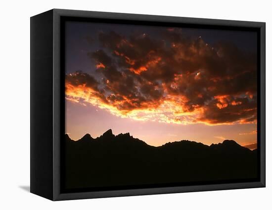 A Setting Sun Casts a Colorful Light on the Teton Mountains Near Jackson Hole-null-Framed Stretched Canvas