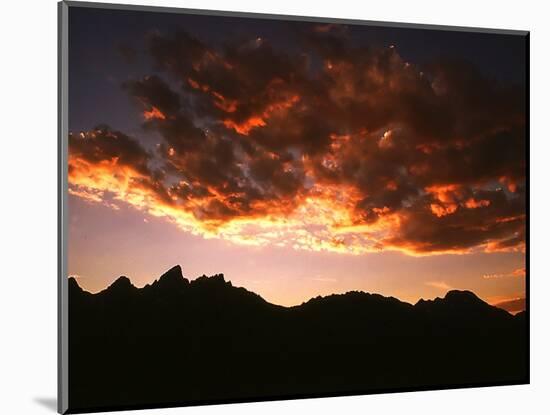 A Setting Sun Casts a Colorful Light on the Teton Mountains Near Jackson Hole-null-Mounted Photographic Print