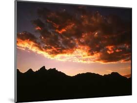 A Setting Sun Casts a Colorful Light on the Teton Mountains Near Jackson Hole-null-Mounted Photographic Print