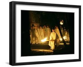 A Shinto Priest Walks, Holding a Wooden Torch, During the Tsukinami-Sai Ritual-null-Framed Premium Photographic Print