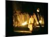 A Shinto Priest Walks, Holding a Wooden Torch, During the Tsukinami-Sai Ritual-null-Mounted Premium Photographic Print