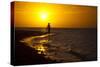 A Silhouette of a Woman Walking in the Waves of the Surf at Sunset in Holbox Island, Mexico-Karine Aigner-Stretched Canvas