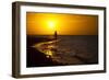 A Silhouette of a Woman Walking in the Waves of the Surf at Sunset in Holbox Island, Mexico-Karine Aigner-Framed Photographic Print