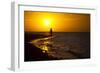 A Silhouette of a Woman Walking in the Waves of the Surf at Sunset in Holbox Island, Mexico-Karine Aigner-Framed Photographic Print