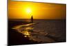 A Silhouette of a Woman Walking in the Waves of the Surf at Sunset in Holbox Island, Mexico-Karine Aigner-Mounted Photographic Print