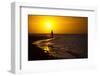 A Silhouette of a Woman Walking in the Waves of the Surf at Sunset in Holbox Island, Mexico-Karine Aigner-Framed Photographic Print