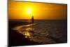 A Silhouette of a Woman Walking in the Waves of the Surf at Sunset in Holbox Island, Mexico-Karine Aigner-Mounted Photographic Print