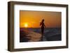 A Silhouette of a Woman Wearing a Hat Walking in the Surf at Sunset on Holbox Island, Mexico-Karine Aigner-Framed Photographic Print