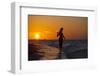 A Silhouette of a Woman Wearing a Hat Walking in the Surf at Sunset on Holbox Island, Mexico-Karine Aigner-Framed Photographic Print