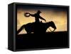 A Silhouetted Cowboy Riding Alone a Ridge at Sunset in Shell, Wyoming, USA-Joe Restuccia III-Framed Stretched Canvas