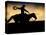 A Silhouetted Cowboy Riding Alone a Ridge at Sunset in Shell, Wyoming, USA-Joe Restuccia III-Stretched Canvas