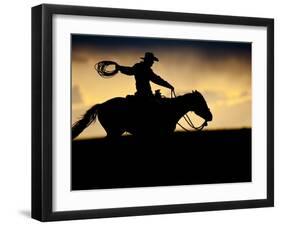 A Silhouetted Cowboy Riding Alone a Ridge at Sunset in Shell, Wyoming, USA-Joe Restuccia III-Framed Premium Photographic Print