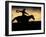 A Silhouetted Cowboy Riding Alone a Ridge at Sunset in Shell, Wyoming, USA-Joe Restuccia III-Framed Premium Photographic Print