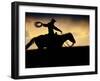 A Silhouetted Cowboy Riding Alone a Ridge at Sunset in Shell, Wyoming, USA-Joe Restuccia III-Framed Premium Photographic Print