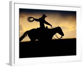 A Silhouetted Cowboy Riding Alone a Ridge at Sunset in Shell, Wyoming, USA-Joe Restuccia III-Framed Photographic Print