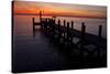 A Single Sailboat Sits on the Water of the Bay Alongside an Empty Dock on Tilghman Island, Maryland-Karine Aigner-Stretched Canvas