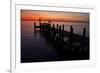 A Single Sailboat Sits on the Water of the Bay Alongside an Empty Dock on Tilghman Island, Maryland-Karine Aigner-Framed Photographic Print