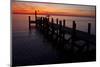 A Single Sailboat Sits on the Water of the Bay Alongside an Empty Dock on Tilghman Island, Maryland-Karine Aigner-Mounted Photographic Print