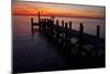 A Single Sailboat Sits on the Water of the Bay Alongside an Empty Dock on Tilghman Island, Maryland-Karine Aigner-Mounted Photographic Print