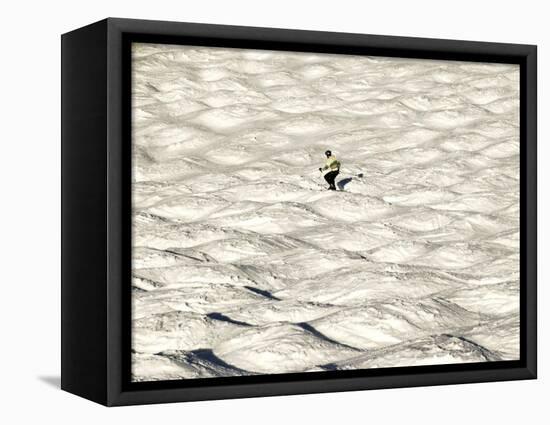 A Skier Makes His Way Down a Sea of Moguls at Sugarbush Ski Area-null-Framed Stretched Canvas