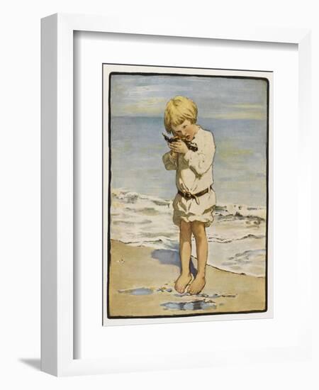 A Small Blond Boy Finds a Seagull with an Injured Wing as He Paddles by the Water's Edge-null-Framed Art Print