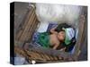 A Small Child Sleeps in a Cart on the Streets of Phnom Penh, Cambodia, Indochina-Andrew Mcconnell-Stretched Canvas