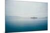 A Small Ferry on Blue Water-Clive Nolan-Mounted Photographic Print