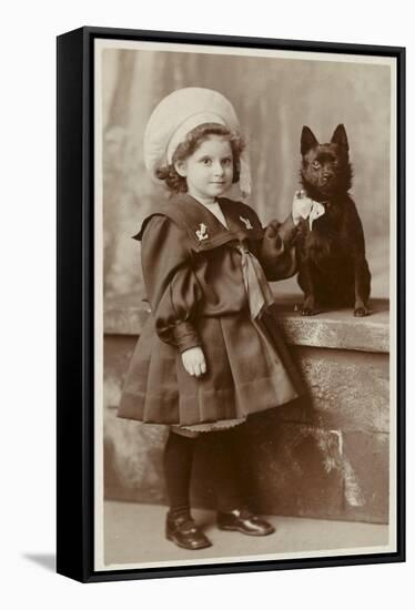 A Small Girl in a Sailor Suit Poses with Her Schipperke-null-Framed Stretched Canvas