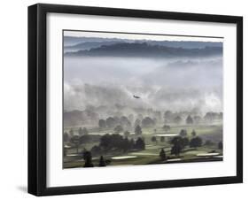 A Small Plane Descends Over Fog Covered Reeves Municipal Golf Course as It Lands at Lunken Airport-null-Framed Premium Photographic Print