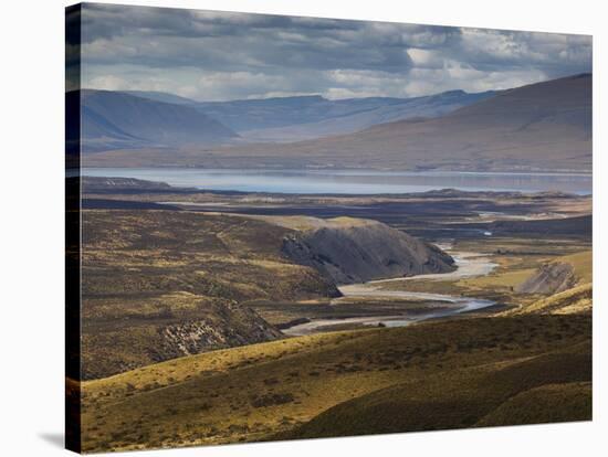 A Small River Runs into a Lake in Torres Del Paine National Park-Alex Saberi-Stretched Canvas