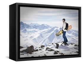 A Snowboarder at the Summit of Mount Affawat in Gulmarg, Kashmir, India-Julian Love-Framed Stretched Canvas