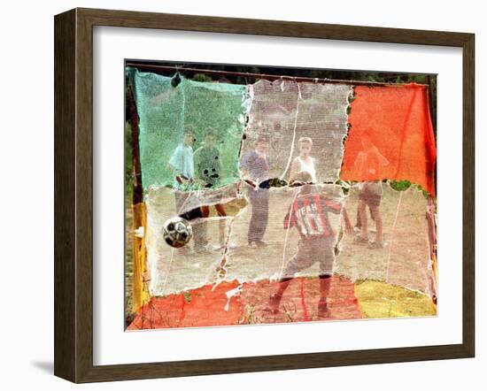 A Soccer Ball Slips Through an Opening of a Makeshift Goal During a Game Played by Bosnian Children-null-Framed Premium Photographic Print