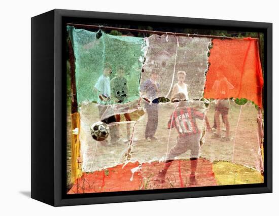 A Soccer Ball Slips Through an Opening of a Makeshift Goal During a Game Played by Bosnian Children-null-Framed Stretched Canvas
