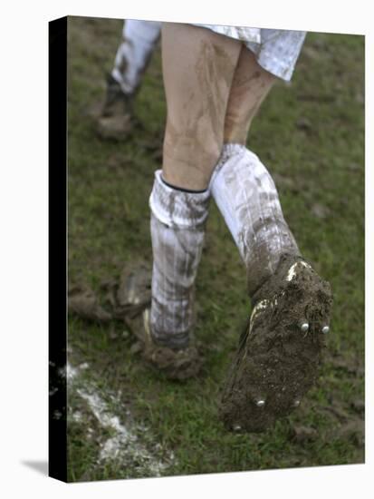 A Soccer Player's Muddy Cleats-null-Stretched Canvas