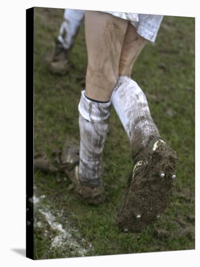 A Soccer Player's Muddy Cleats-null-Stretched Canvas