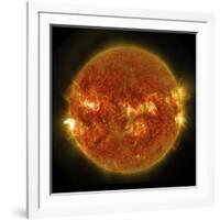 A Solar Flare Erupting on the Left Side of the Sun-null-Framed Art Print