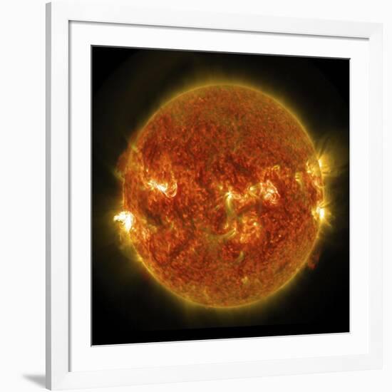 A Solar Flare Erupting on the Left Side of the Sun-null-Framed Art Print