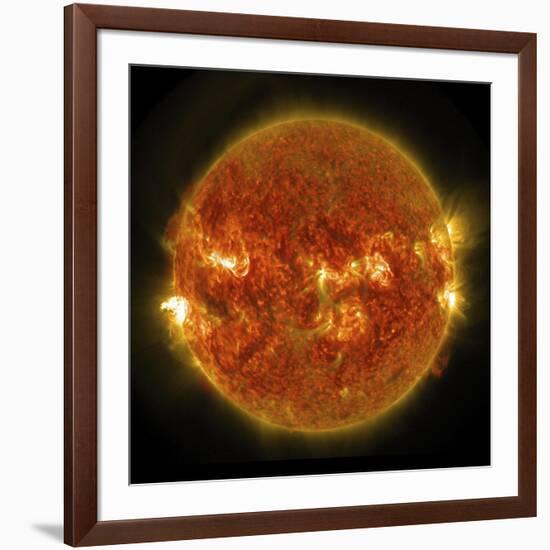 A Solar Flare Erupting on the Left Side of the Sun-null-Framed Art Print