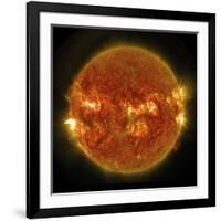 A Solar Flare Erupting on the Left Side of the Sun-null-Framed Art Print