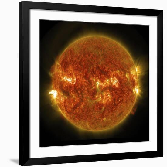 A Solar Flare Erupting on the Left Side of the Sun-null-Framed Art Print