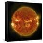 A Solar Flare Erupting on the Left Side of the Sun-null-Framed Stretched Canvas