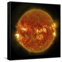A Solar Flare Erupting on the Left Side of the Sun-null-Framed Stretched Canvas